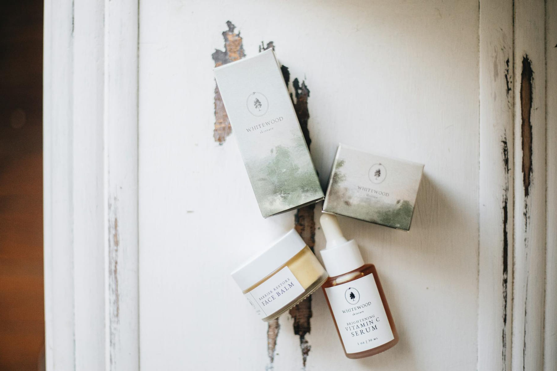 Elegant display of luxury skincare products with a natural, minimalist aesthetic. on Purely Polished