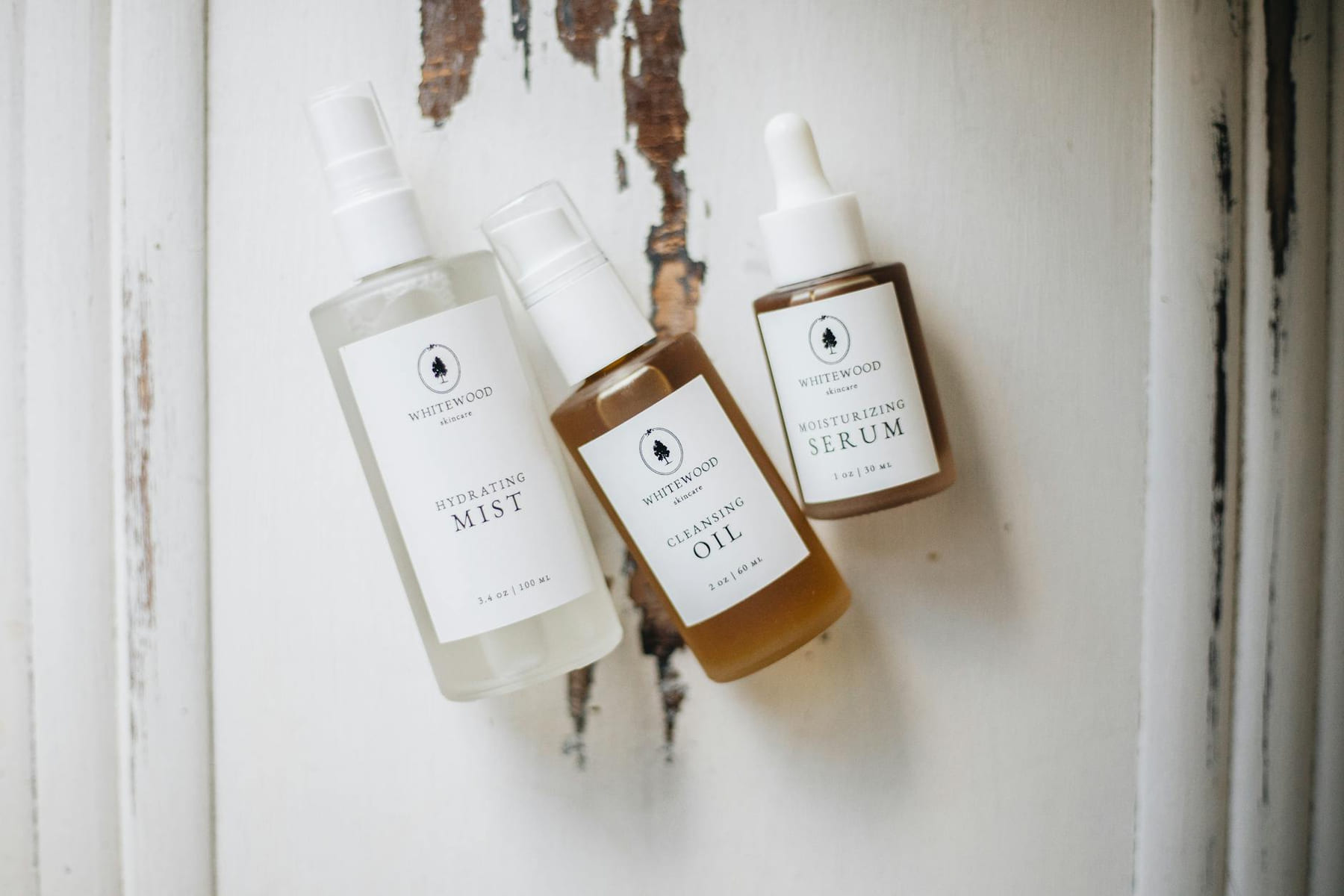 Flat lay of organic skincare products on rustic background, ideal for beauty and wellness use. on Purely Polished