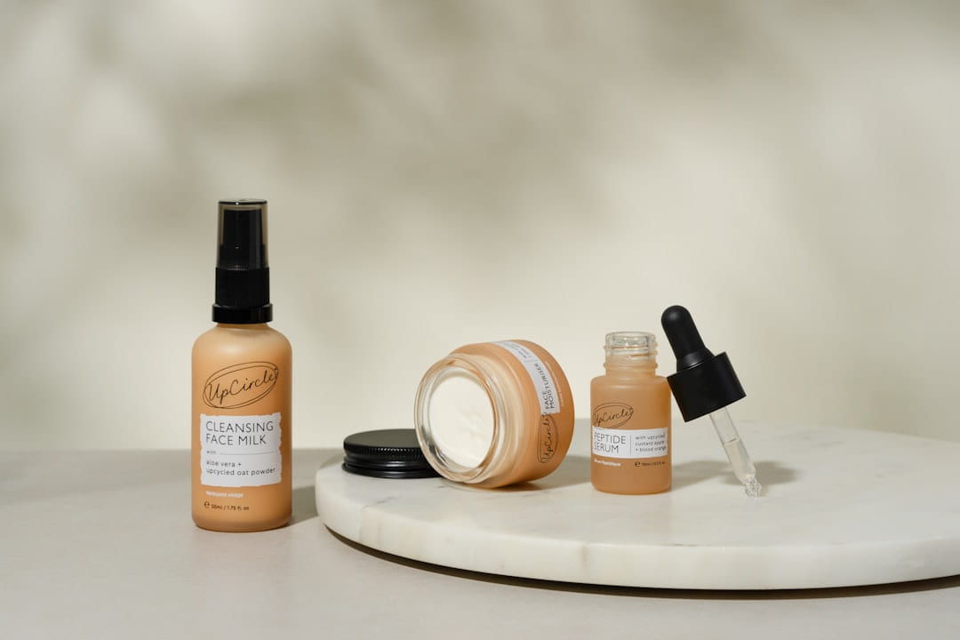 A white table topped with bottles of makeup on Purely Polished