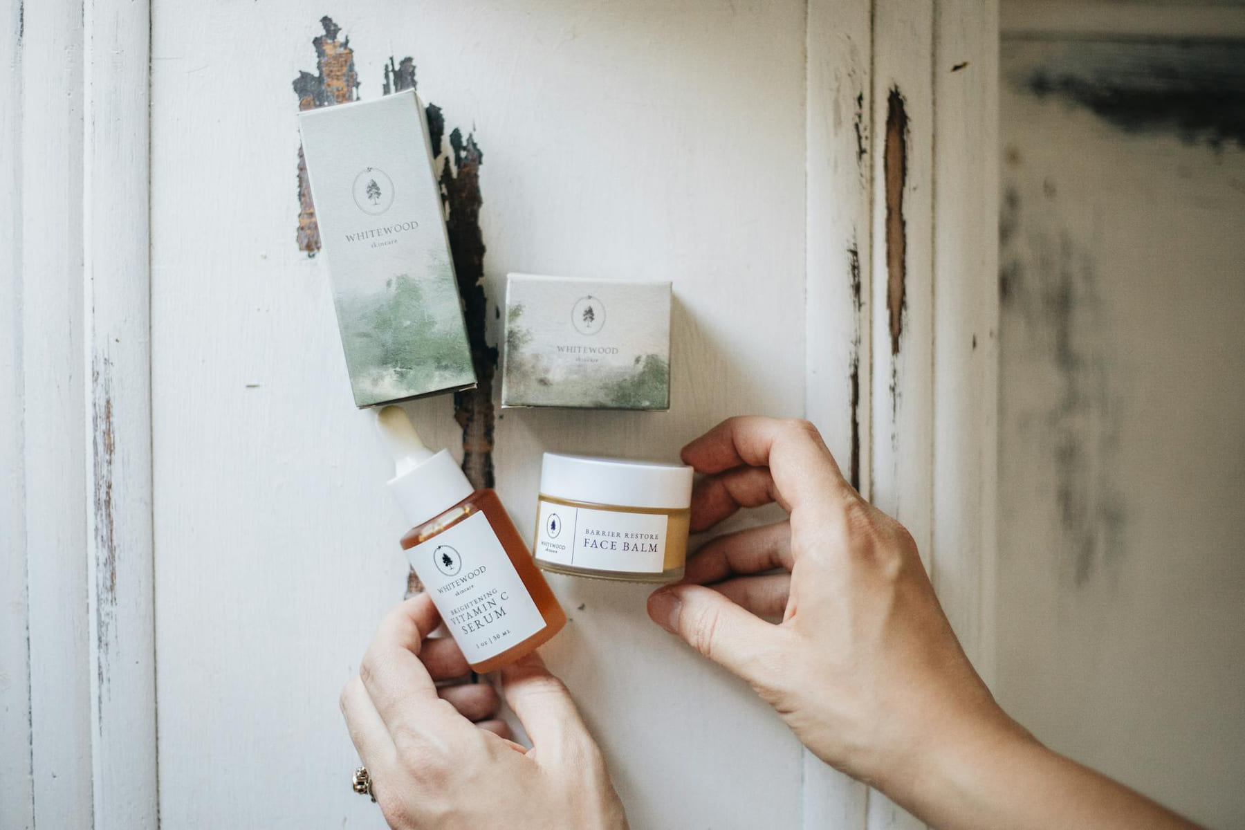 Flat lay of artisanal skincare products on a rustic surface, showcasing natural beauty essentials. on Purely Polished